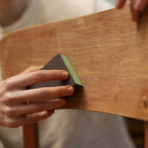 side-view-woman-restoring-wooden-chair (3)
